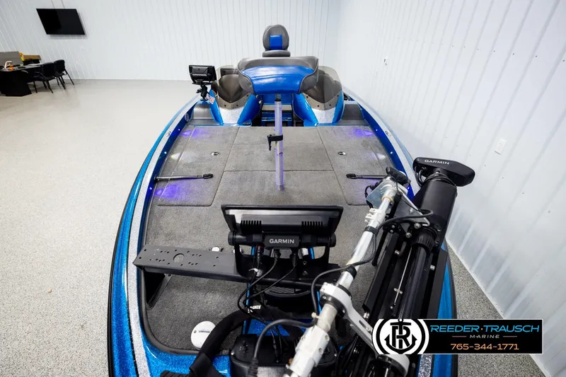 Slide: The Image of 2008 Triton 20X2 DC boat with Garmin equipment in a showroom. - 15