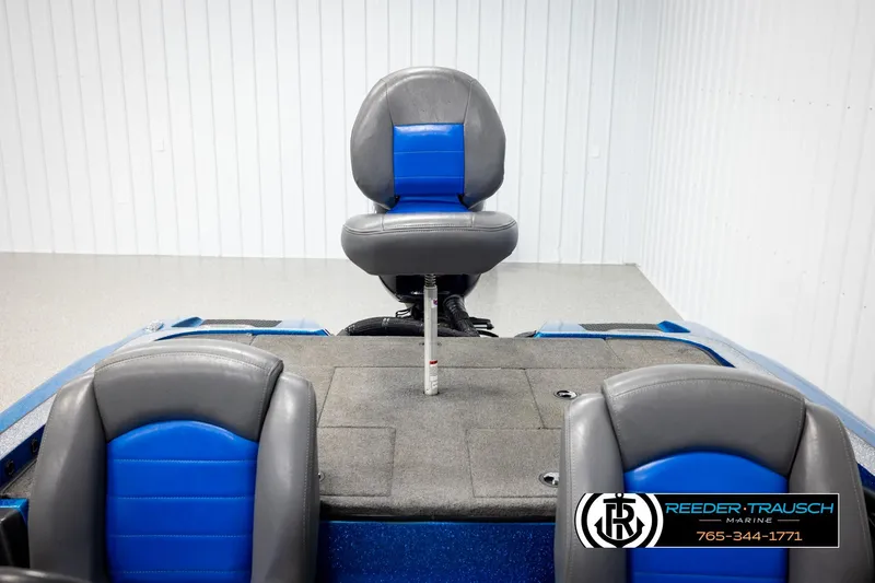 Slide: The Image of 2008 Triton 20X2 DC boat interior with blue and gray seating, Reeder-Trausch Marine logo. - 17