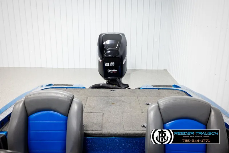 Slide: The Image of 2008 Triton 20X2 DC boat interior with Mercury OptiMax Pro motor, blue and gray seats. - 18