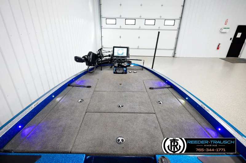 Slide: The Image of 2008 Triton 20X2 DC boat interior with fishing equipment and navigation system. - 22