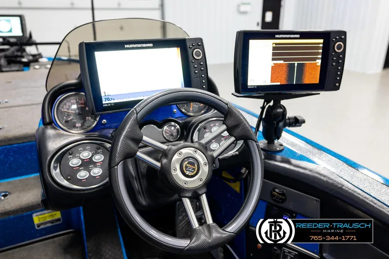 Slide: The Image of 2008 Triton 20X2 DC boat dashboard with Humminbird electronics and steering wheel. - 27