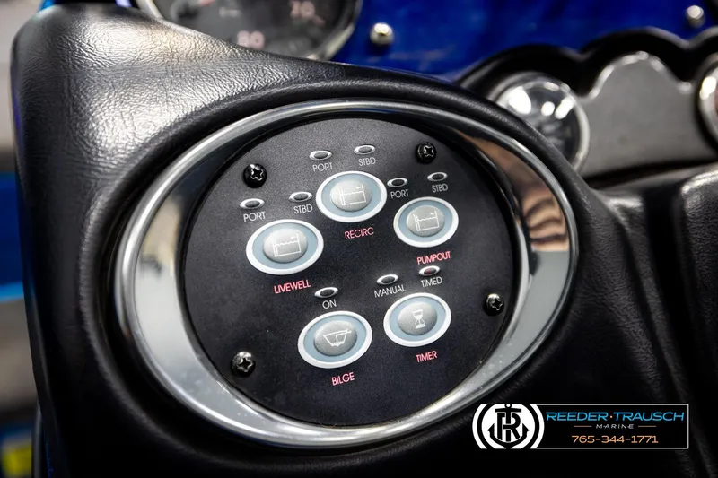 Slide: The Image of Control panel of a 2008 Triton 20X2 DC boat with various function buttons. - 29