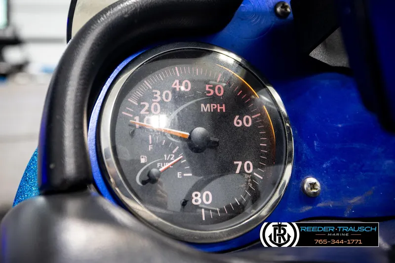 Slide: The Image of Close-up of a 2008 Triton 20X2 DC speedometer, showing speed in MPH and fuel gauge. - 30