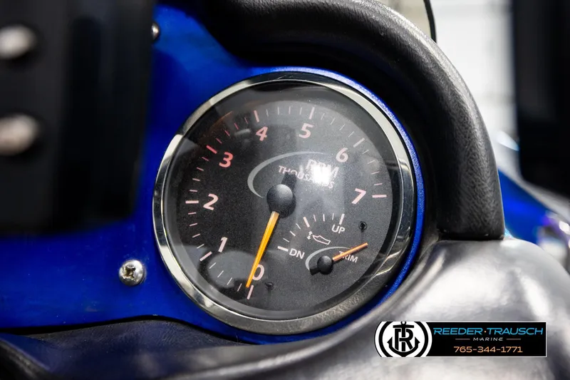 Slide: The Image of Close-up of a 2008 Triton 20X2 DC boat tachometer with Reeder-Trausch Marine logo. - 33