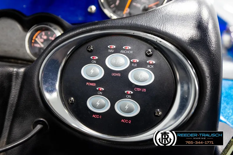 Slide: The Image of Control panel of a 2008 Triton 20X2 DC boat with various switches and indicators. - 34