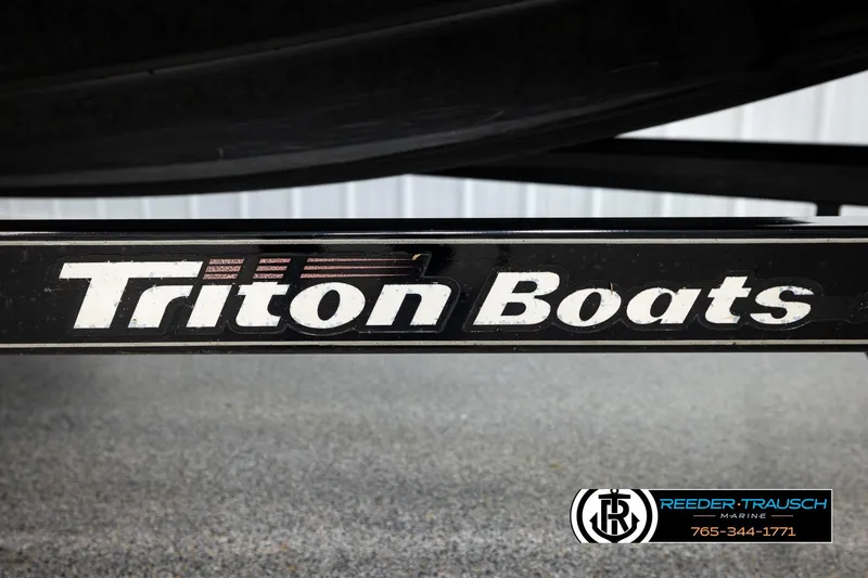 Slide: The Image of 2008 Triton 20X2 DC boat trailer with Reeder-Trausch Marine branding. - 55
