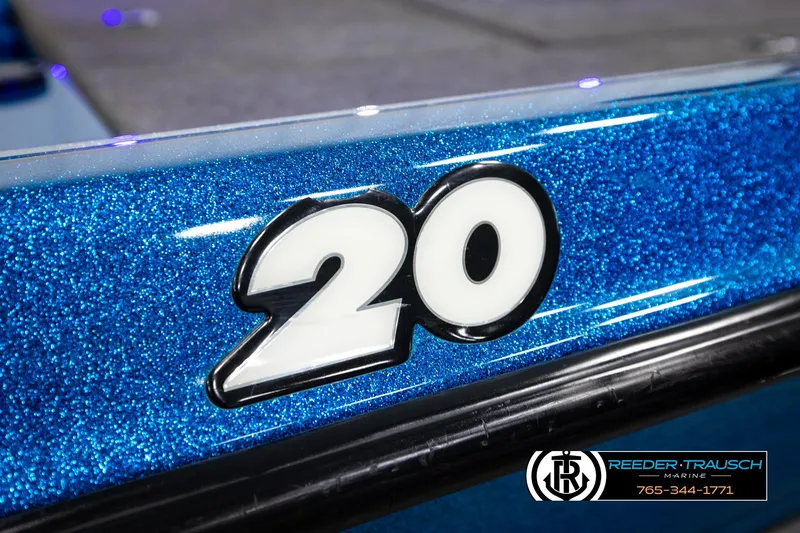 Slide: The Image of Close-up of a 2008 Triton 20X2 DC boat with glittery blue finish and "20" decal. - 57