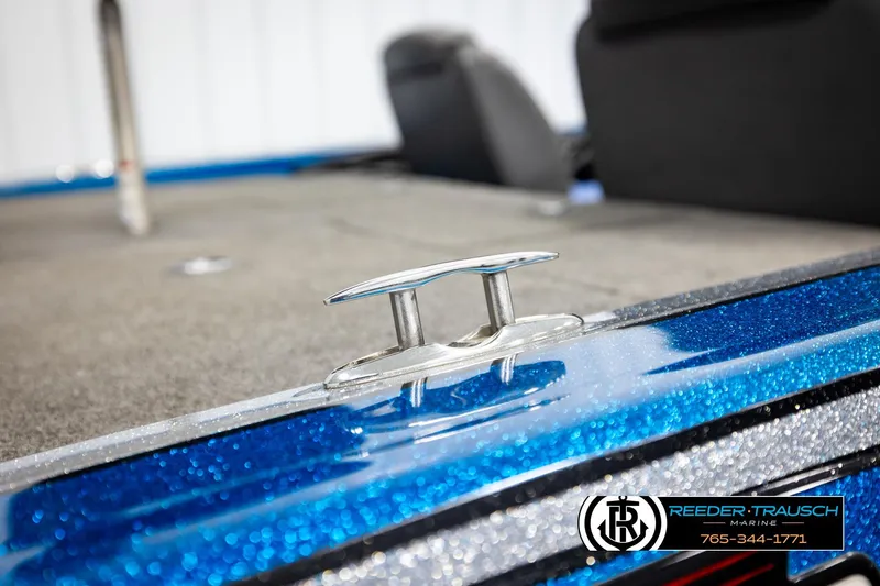 Slide: The Image of 2008 Triton 20X2 DC boat detail with metallic blue finish and cleat. - 59