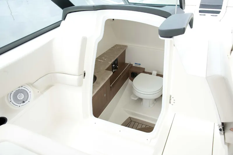 Slide: The Image of Manufacturer Provided Image: 2016 Boston Whaler 270 Vantage boat interior with toilet and sink. - 11