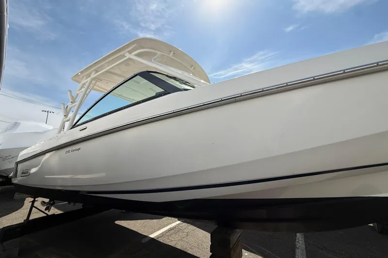 Slide: The Image of 2016 Boston Whaler 270 Vantage boat under clear blue sky. - 15