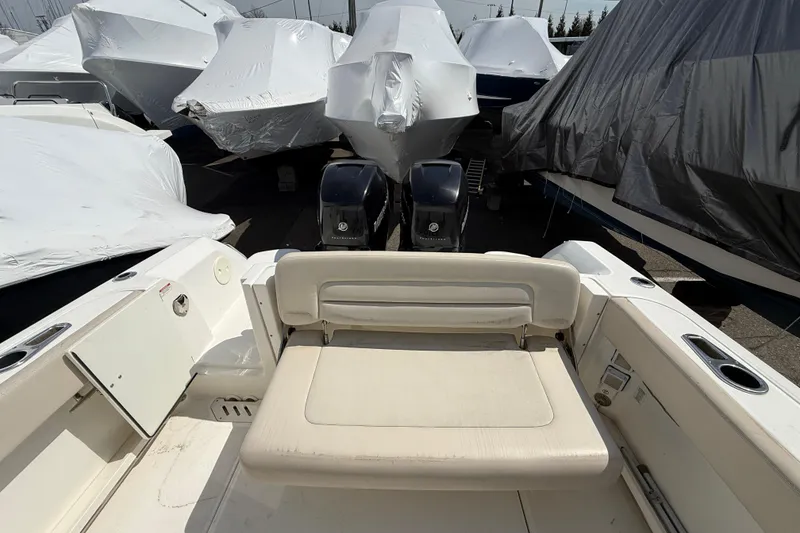 Slide: The Image of 2016 Boston Whaler 270 Vantage boat with covered vessels in storage area. - 19