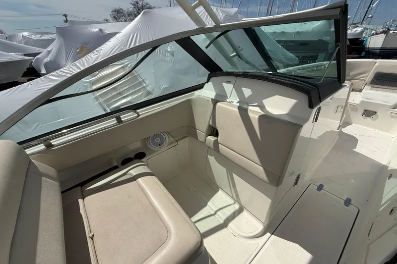 Slide: The Image of 2016 Boston Whaler 270 Vantage boat interior with seating and windshield. - 28