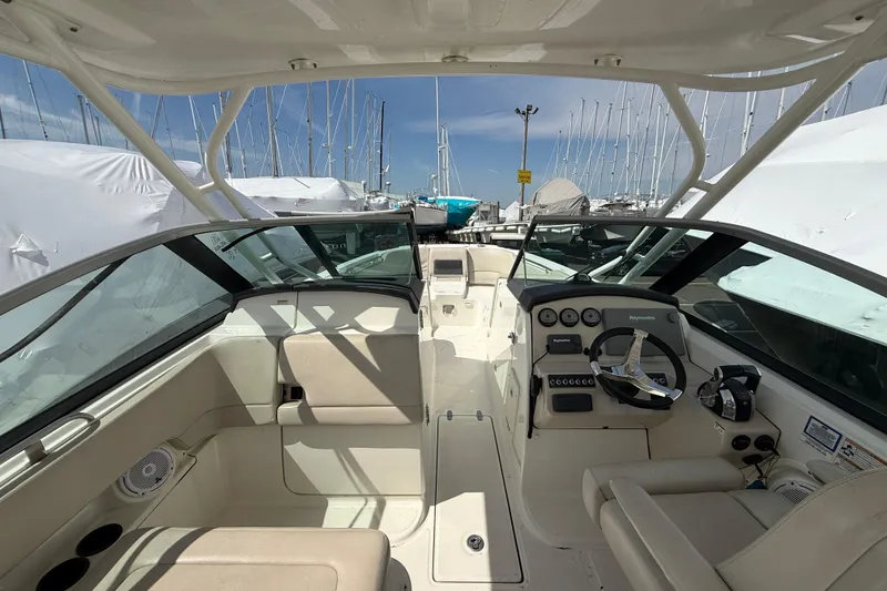 Slide: The Image of 2016 Boston Whaler 270 Vantage boat interior with steering wheel and seating. - 29