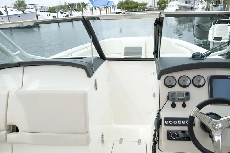 Slide: The Image of Manufacturer Provided Image: 2016 Boston Whaler 270 Vantage boat cockpit with steering wheel and control panel. - 8