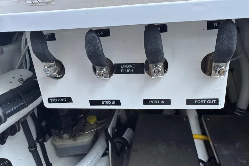 Slide: The Image of Control panel of a 2024 Nor-Tech 400 Supersport boat with labeled switches. - 11