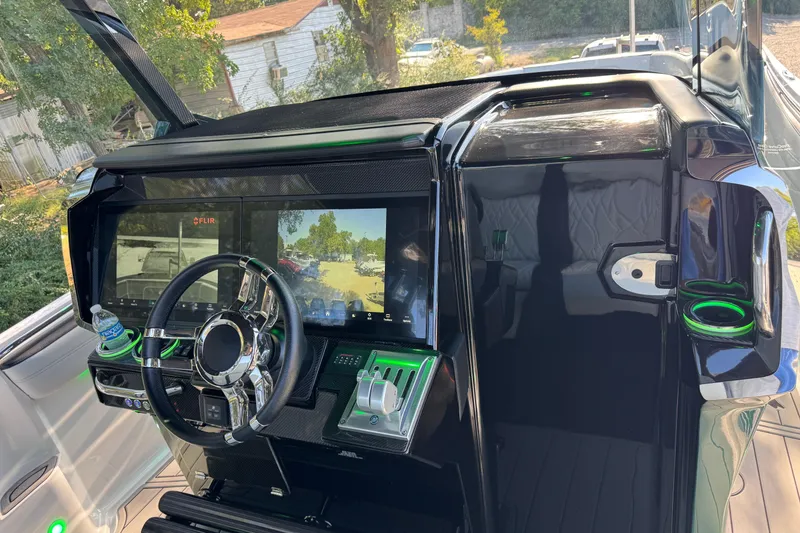 Slide: The Image of 2024 Nor-Tech 400 Supersport dashboard with advanced navigation and control systems. - 13