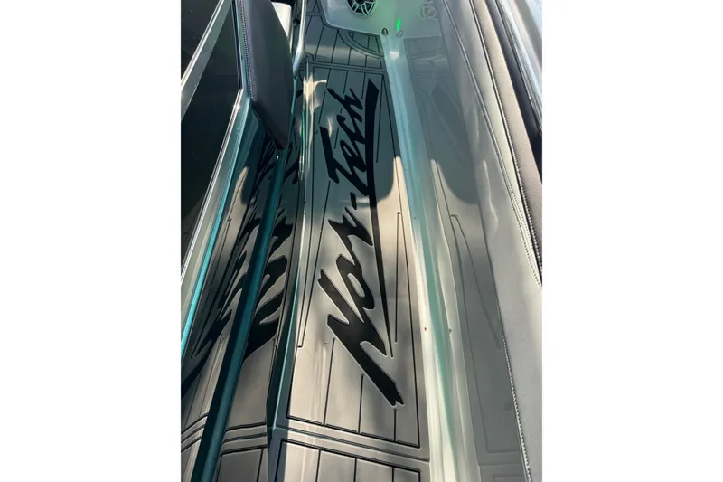Slide: The Image of 2024 Nor-Tech 400 Supersport boat deck with logo in sunlight. - 18