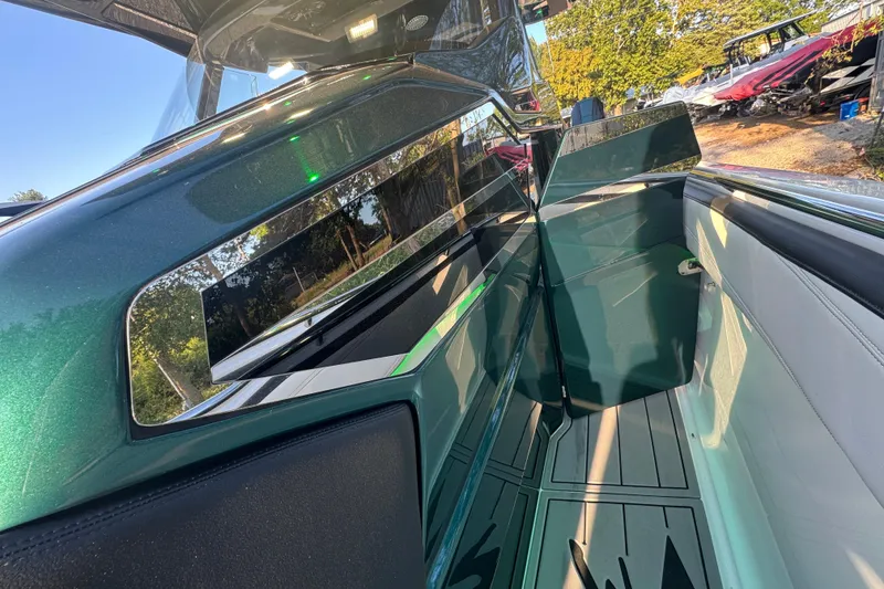 Slide: The Image of 2024 Nor-Tech 400 Supersport boat interior with sleek design and reflective surfaces. - 23