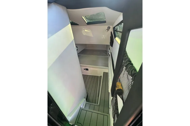 Slide: The Image of 2024 Nor-Tech 400 Supersport cabin interior with modern design and skylight. - 25