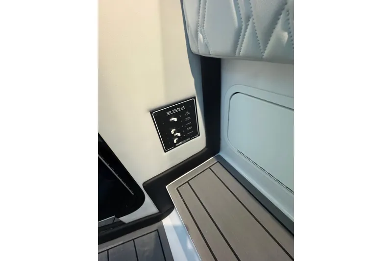 Slide: The Image of 2024 Nor-Tech 400 Supersport interior panel with 120 volts AC controls. - 27