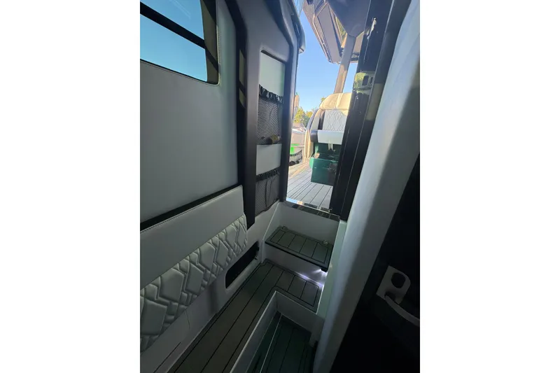 Slide: The Image of Interior view of 2024 Nor-Tech 400 Supersport boat, featuring sleek design and modern seating. - 30