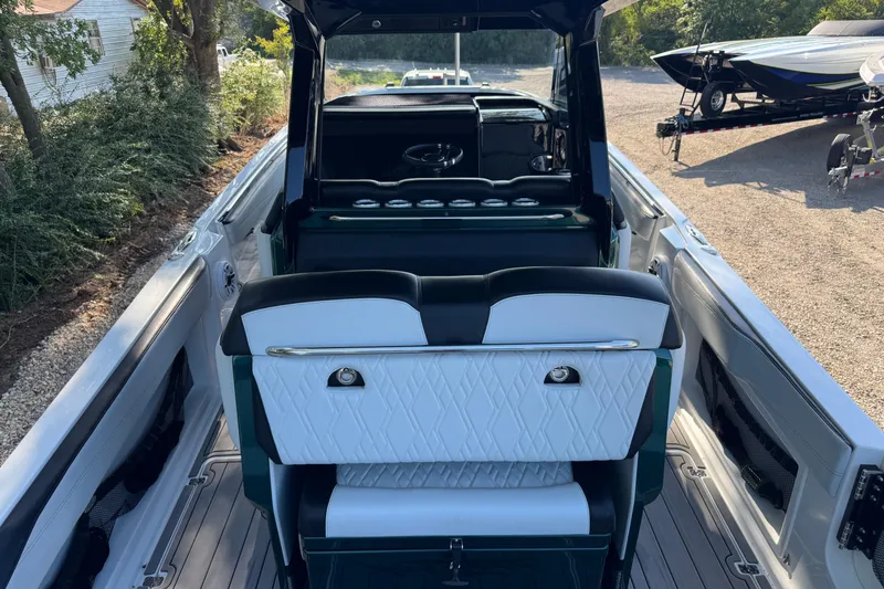 Slide: The Image of 2024 Nor-Tech 400 Supersport boat interior with luxurious seating and modern design. - 9