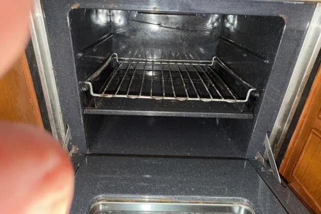 Slide: The Image of Empty oven interior with metal rack, Mao Ta Skye 51, 1980 model. - 15