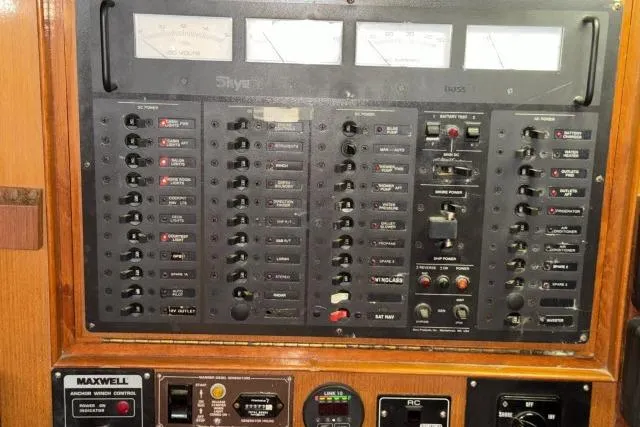 Slide: The Image of Electrical control panel of a 1980 Mao Ta Skye 51 yacht with various switches and gauges. - 17