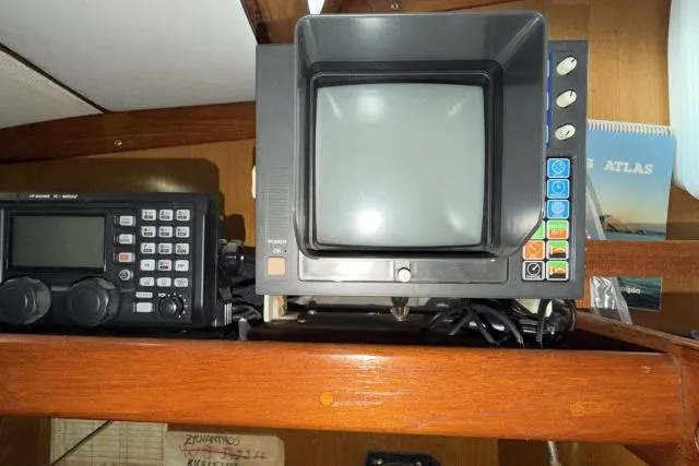 Slide: The Image of Vintage Mao Ta Skye 51 electronics on wooden shelf, featuring retro buttons and display. - 21