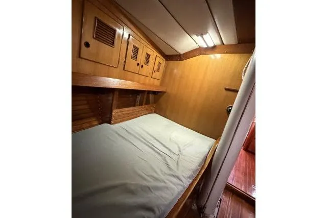 Slide: The Image of Cozy cabin interior of 1980 Mao Ta Skye 51 sailboat with wooden finish. - 32