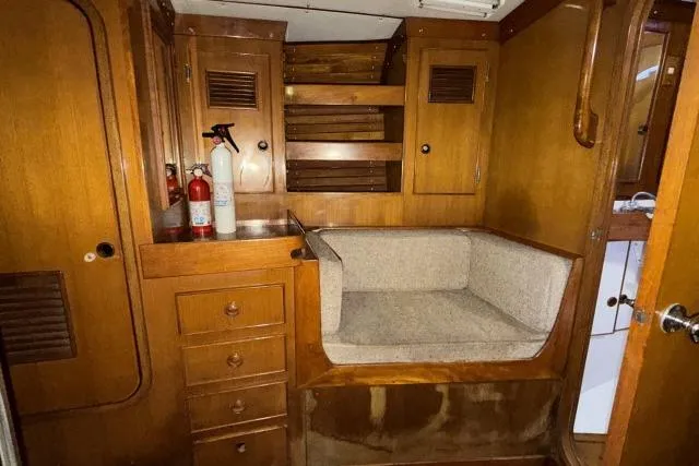 Slide: The Image of 1980 Mao Ta Skye 51 yacht interior with wooden cabinetry and seating area. - 33