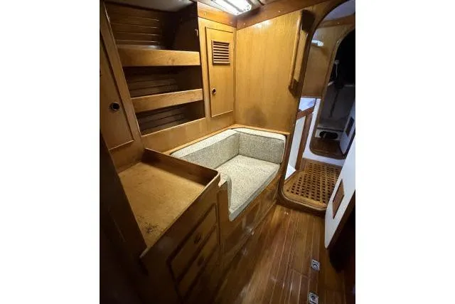 Slide: The Image of 1980 Mao Ta Skye 51 yacht interior with wooden cabinetry and cushioned seating. - 34