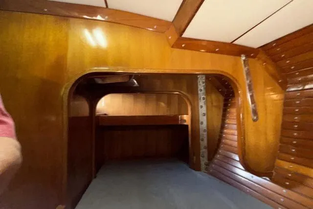 Slide: The Image of Interior of 1980 Mao Ta Skye 51 sailboat with wooden paneling and cozy cabin space. - 38