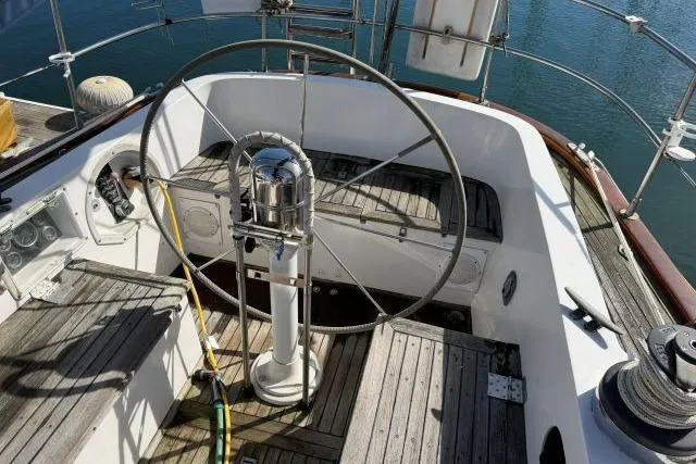 Slide: The Image of Cockpit of 1980 Mao Ta Skye 51 sailboat with wooden seating and steering wheel. - 41