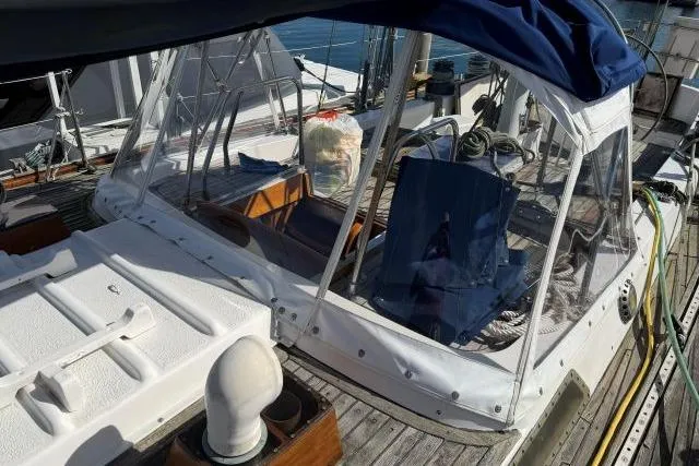 Slide: The Image of 1980 Mao Ta Skye 51 sailboat with clear cockpit enclosure and nautical equipment. - 51