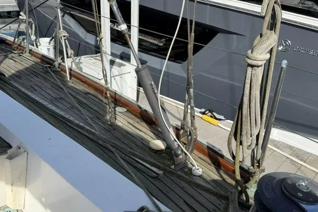 Slide: The Image of 1980 Mao Ta Skye 51 sailboat deck with rigging and ropes. - 52