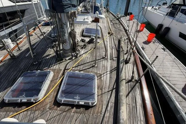 Slide: The Image of Deck of 1980 Mao Ta Skye 51 sailboat with hatches and rigging in marina. - 56