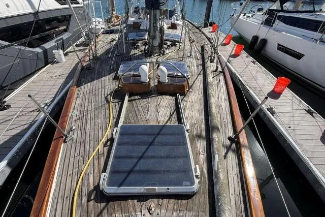 Slide: The Image of Deck view of 1980 Mao Ta Skye 51 sailboat docked at marina. - 58