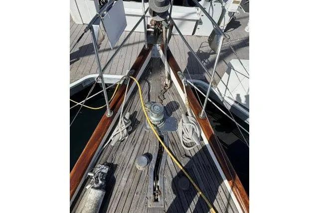 Slide: The Image of Bow of 1980 Mao Ta Skye 51 sailboat with deck equipment and ropes. - 59