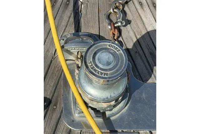Slide: The Image of Winch on 1980 Mao Ta Skye 51 sailboat deck with yellow rope and metal fittings. - 62