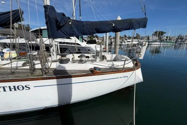 Slide: The Image of Sailboat docked in marina, Mao Ta Skye 51, 1980 model, with blue sail cover. - 65
