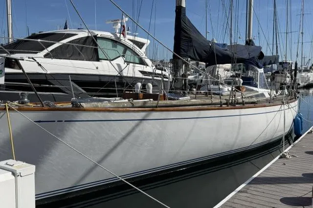 Slide: The Image of Sailboat Mao Ta Skye 51, 1980 model, docked at marina with clear blue sky. - 66