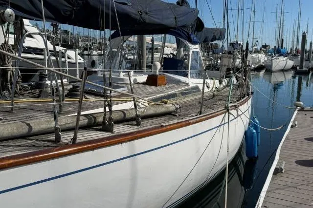 Slide: The Image of Sailboat docked in marina, Mao Ta Skye 51, 1980 model, with blue covers. - 67