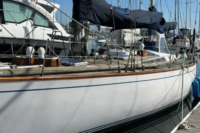 Slide: The Image of 1980 Mao Ta Skye 51 sailboat docked at marina, side view. - 68