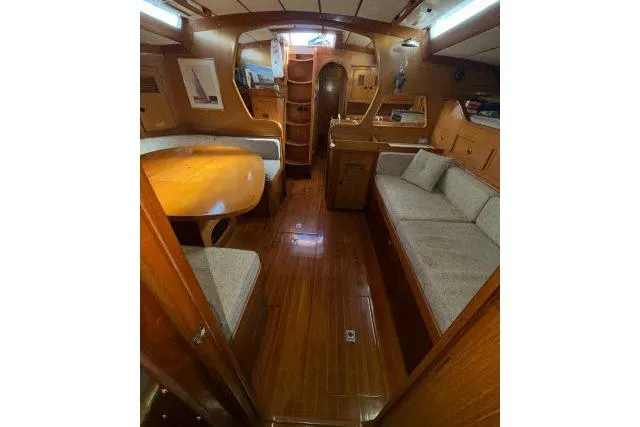 Slide: The Image of Interior of 1980 Mao Ta Skye 51 yacht with wooden furnishings and cozy seating. - 7