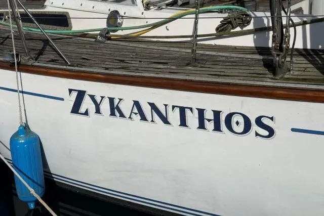 Slide: The Image of Sailboat "Zykanthos," Mao Ta Skye 51, 1980 model, docked with visible blue fender. - 72