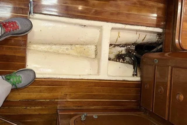 Slide: The Image of Interior view of 1980 Mao Ta Skye 51 sailboat with wooden flooring and storage compartment. - 73