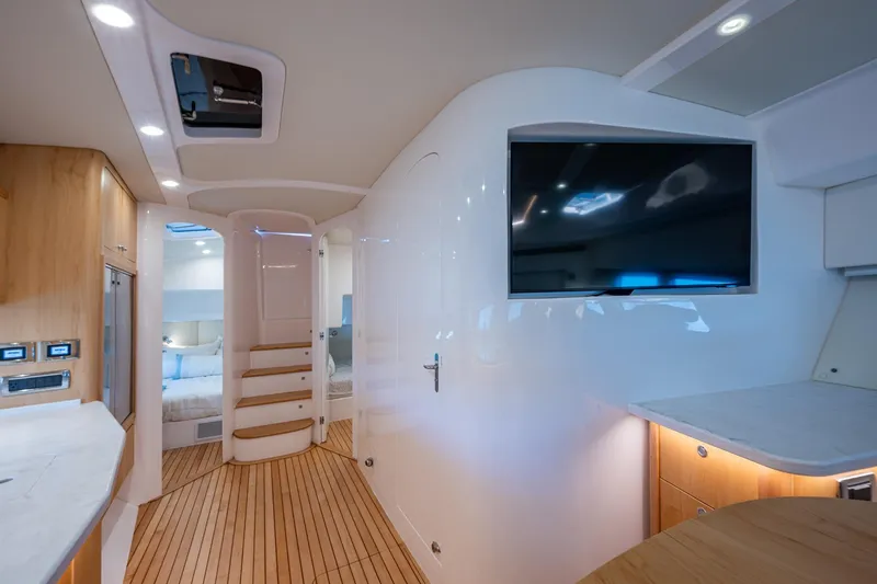 Slide: The Image of Luxurious interior of 2023 Intrepid 477 Evolution yacht with modern amenities and sleek design. - 24