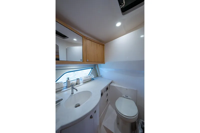 Slide: The Image of Luxurious bathroom in 2023 Intrepid 477 Evolution yacht with modern fixtures and sleek design. - 30