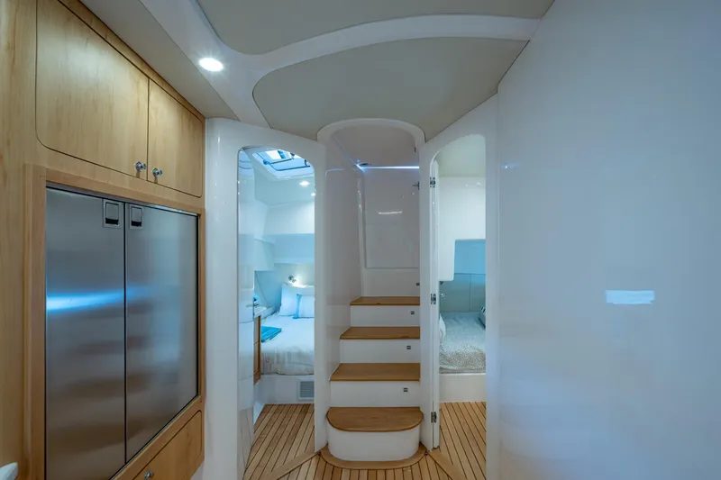 Slide: The Image of Luxurious interior of 2023 Intrepid 477 Evolution yacht with modern design and wooden accents. - 35